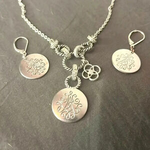 Vintage Avon Silver necklace with matching earrings.